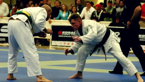 Two competitors looking for takedowns in a Brazilian Jiu Jitsu competition