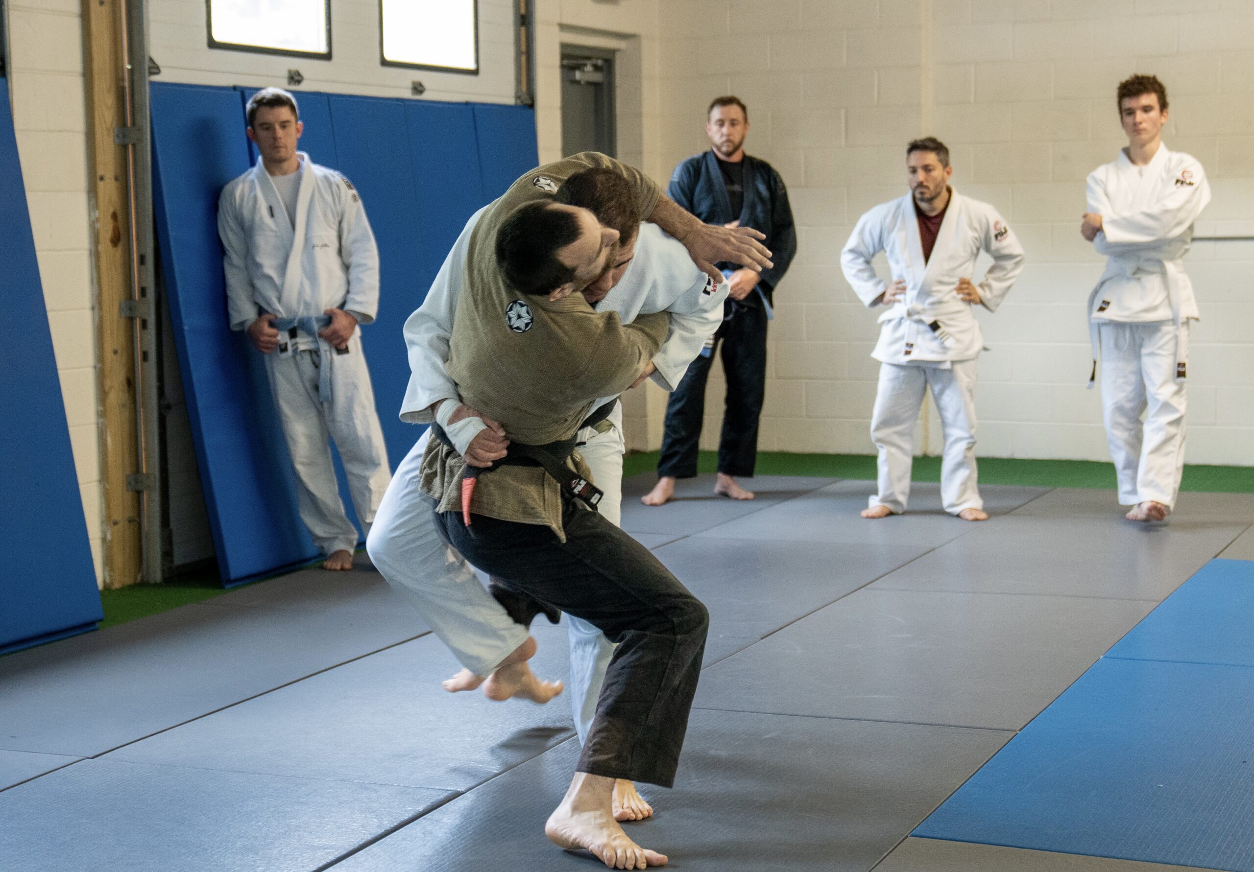 Brazilian jiu jitsu instructor teaching a takedown during BJJ class at Spartan Mixed Martial Arts in Ocean Township NJ