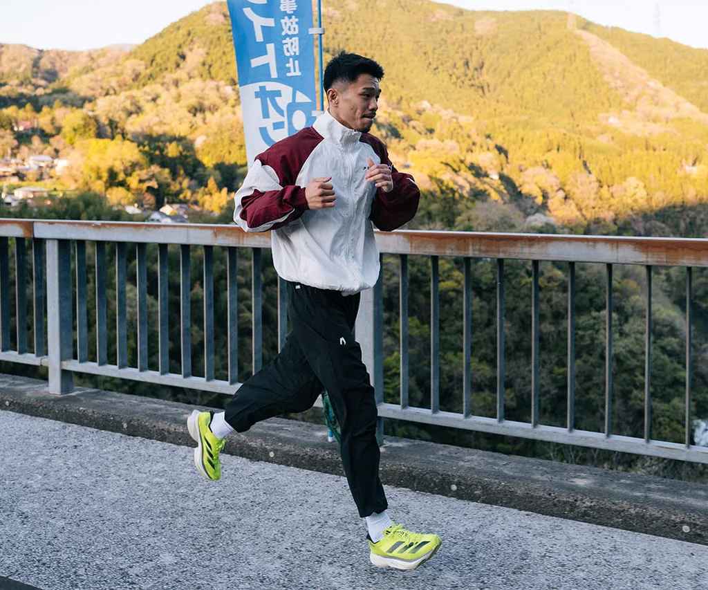 Martial artist running on the road to improve cardio and conditioning for martial arts training
