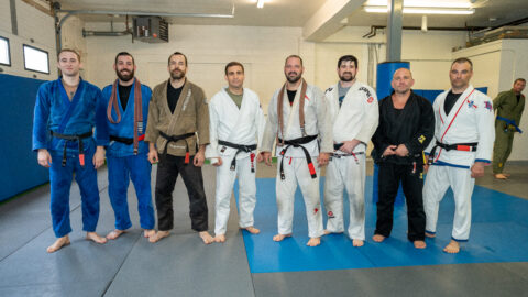 Brazilian jiu jitsu black belts posing after belt promotion ceremony near Asbury Park NJ