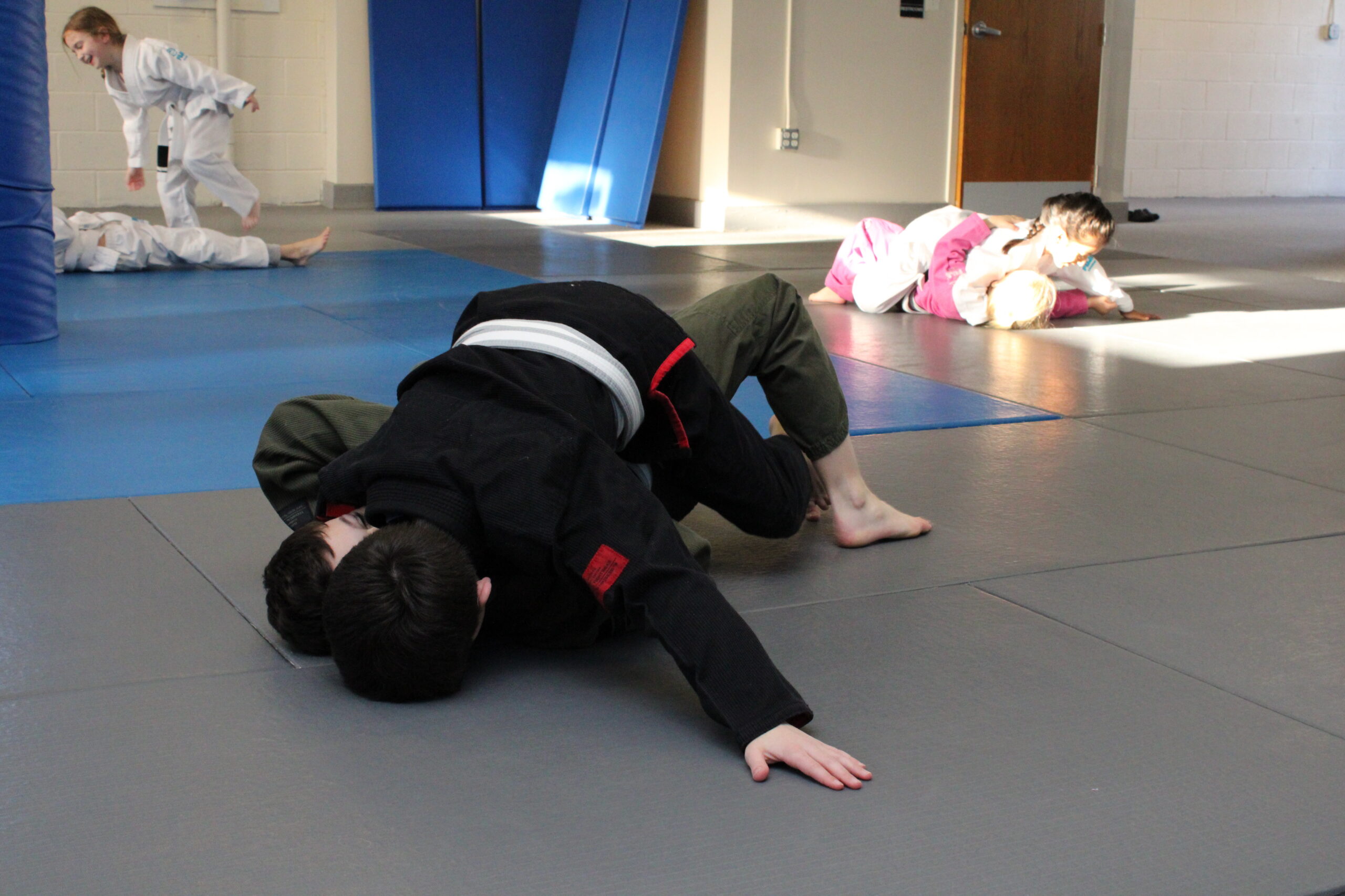 Kids practicing the mount position during Brazilian Jiu-Jitsu class in Ocean Township NJ