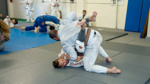 Students sparring in Brazilian Jiu-Jitsu class three times a week